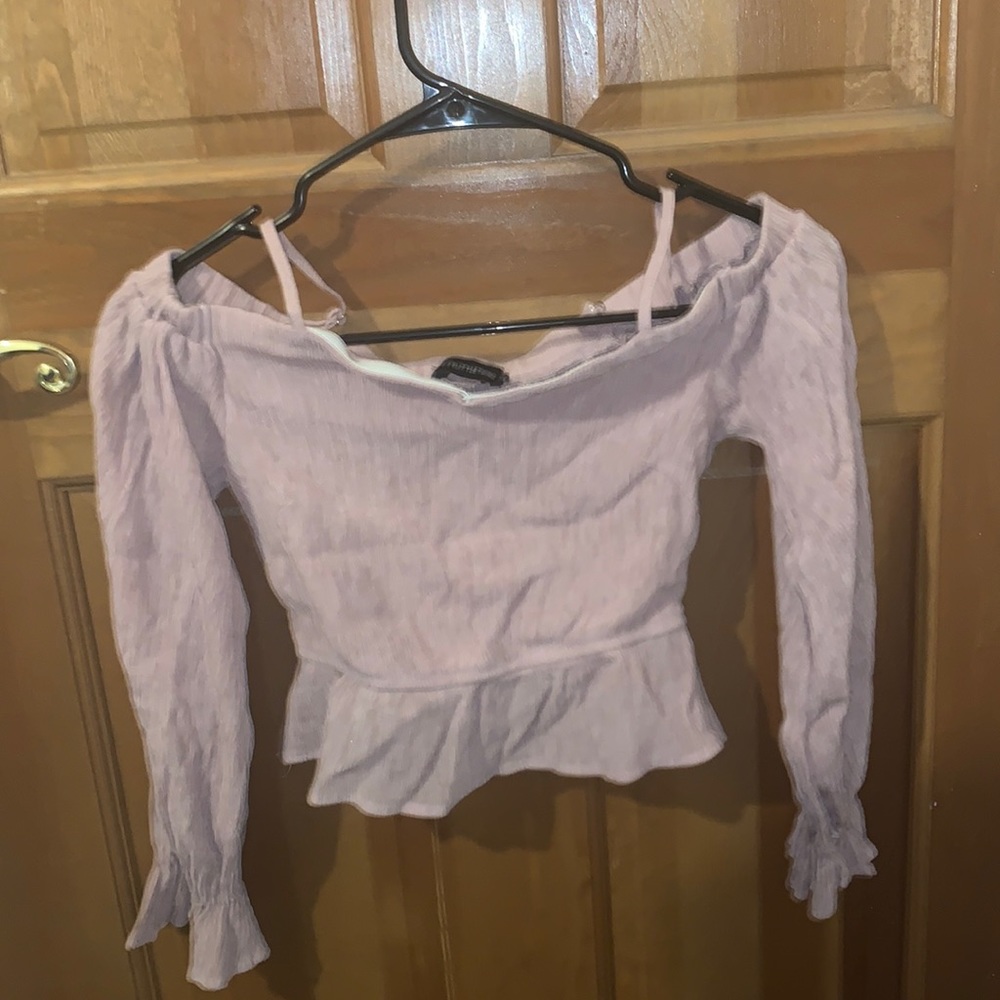 Pinkish tan crop top. It’s cute but doesn’t fit right.
